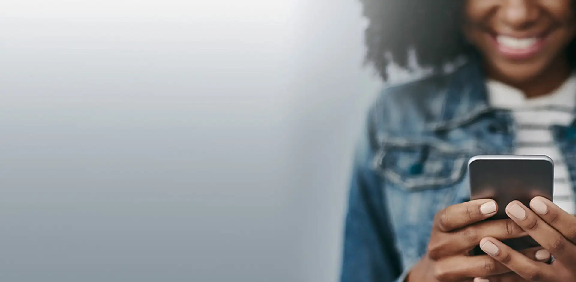 Hero Black Woman Holding Phone Smiling